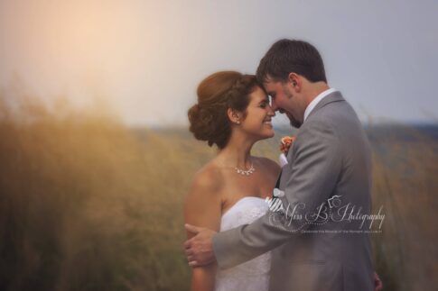 fort gratiot lighthouse beach bride and groom golden hour lake huron photo