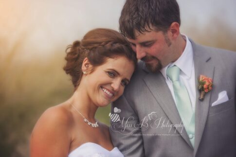 fort gratiot lighthouse beach bride and groom golden hour lake huron photo