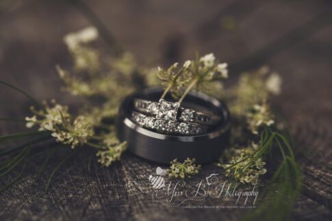 wedding ring detail photo on wood