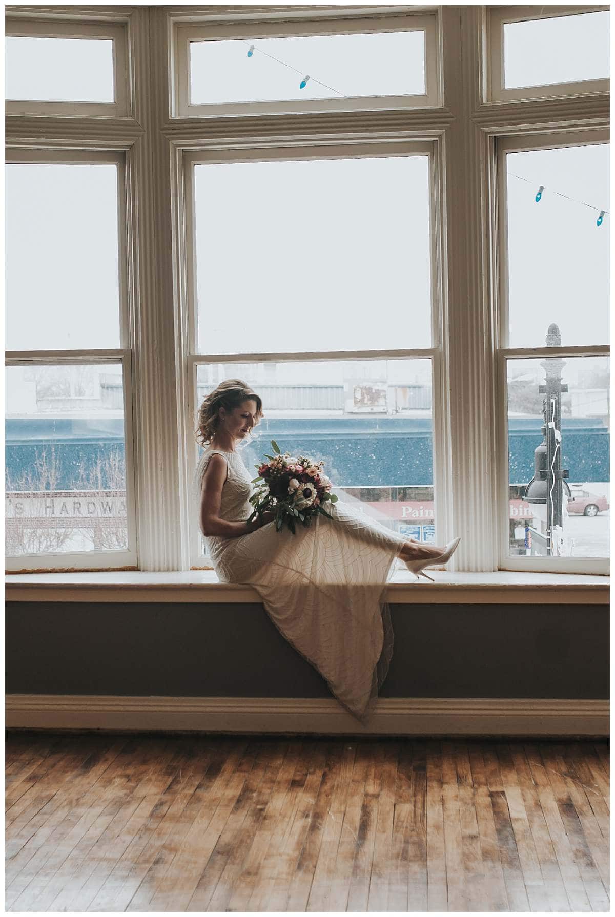 Bridal formals industrial building, bride in window, detroit wedding