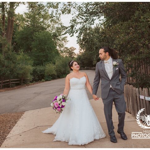 Detroit zoo wedding, polar bear wedding, detroit wedding at the zoo, bride and groom walking through detroit zoo