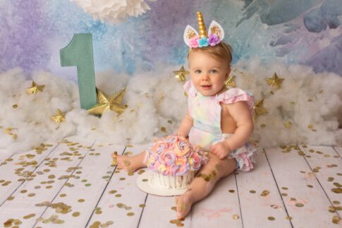 unicorn first birthday photo, 1 year photo, baby girl unicorn photoshoot, port huron studio photographer, cake smash, unicorn cake smash,