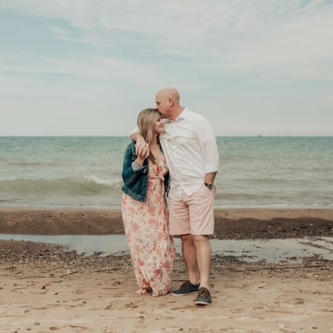 Port huron beach couples shoot, engagement session, kissing at the beach,