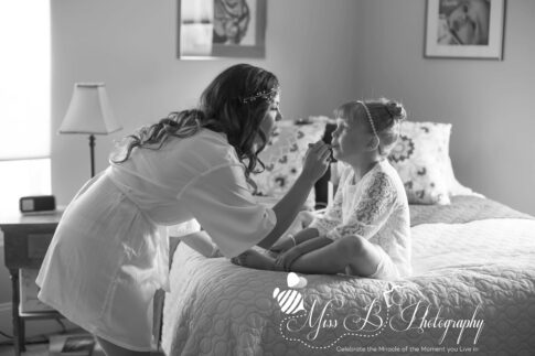 Bride and daughter getting ready